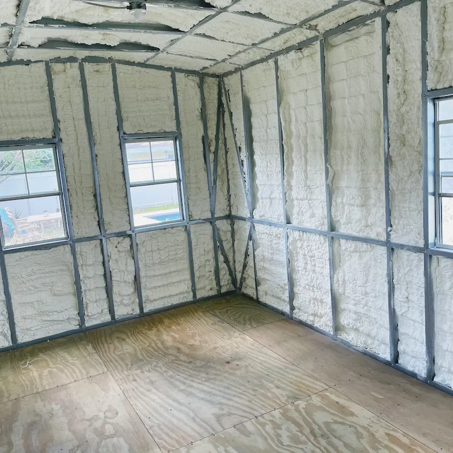 Closed-cell spray foam insulation applied to wall cavities in a residential project in Alafaya